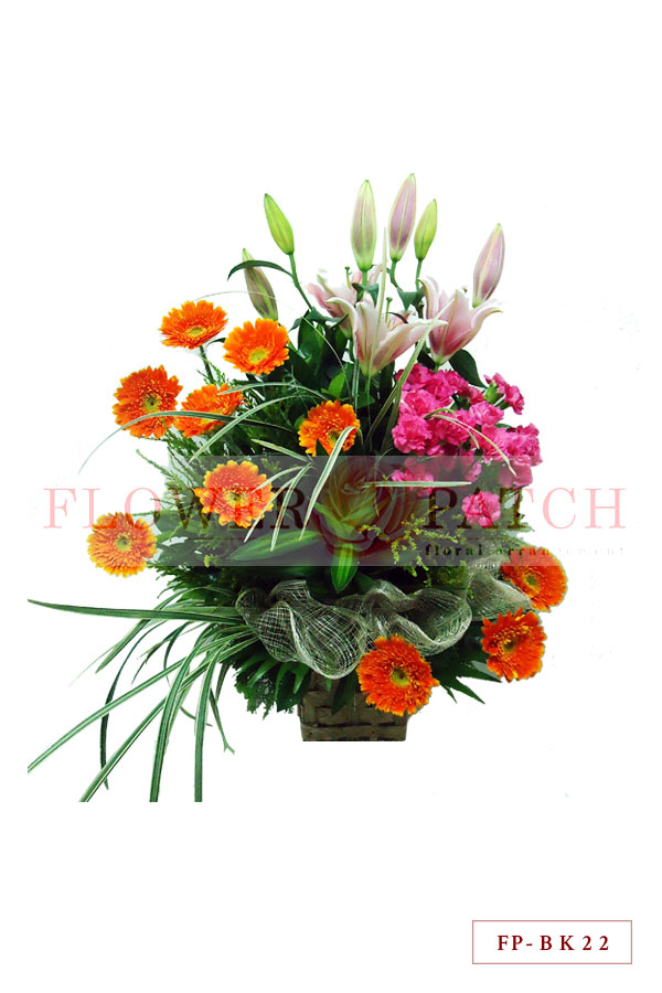 2 Stems of Stargazer Lily, 1 Dozen Spray Carnation and 10 Gerberas in a Basket