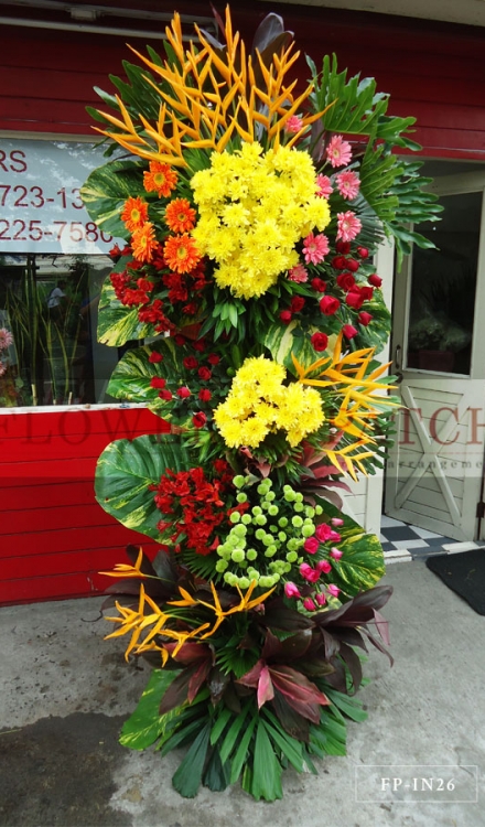 Standing Arrangement of Gerberas, Green Button Mums, Red and Pink Roses, Yellow Mums, Alstromerias, Heliconias