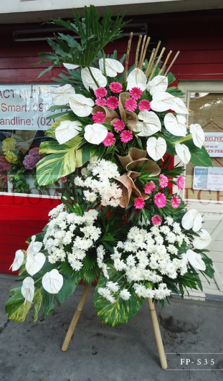 Standing Arrangement of White Anthuriums, Gerberas & Mums | Sympathy & Funeral Flowers Delivery