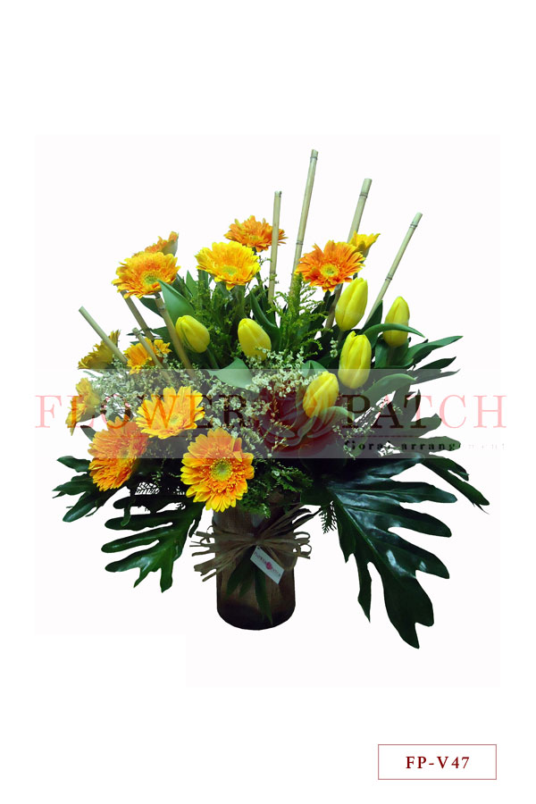 1 Dozen Gerbera and 6 Tulips in a Vase