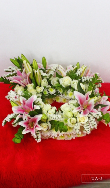 Urn Arrangement of Stargazer Lilies, Roses, Mums, and Statice
