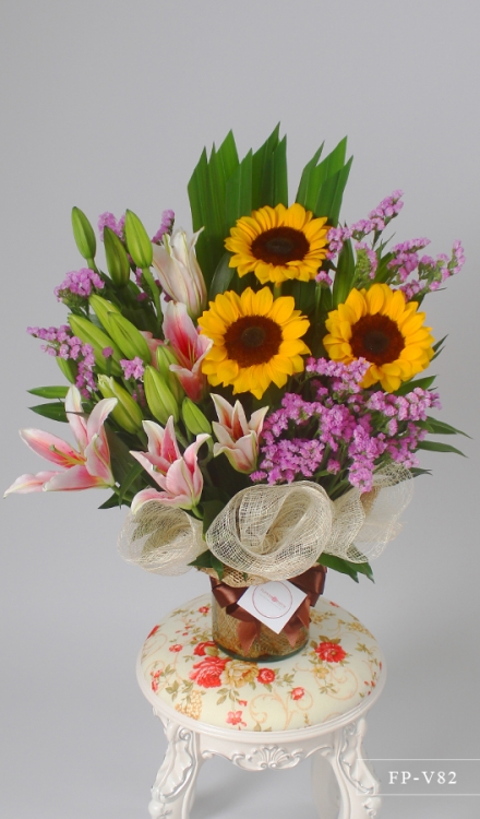 3 Sunflowers and 3 Stems of Stargazer Lily in a Vase