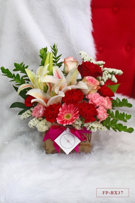 3 Imported Roses, 9 Carnations, 1 Stem Stargazer Lily and 1 Gerbera in a Box