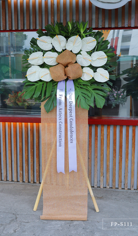 Standing arrangement of white anthuriums