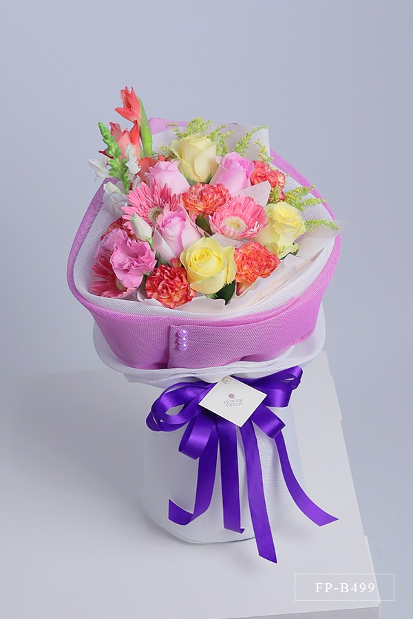 FP-B499 product photo Bouquet of 6 Imported Roses, 5 Carnations, 3 Gerberas and 1 Stem Lisianthus